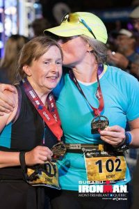 Photo of Diane and Kory at the Ironman finish line