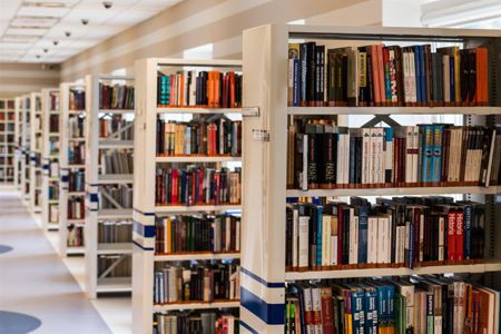 Photo of books shelves at a library