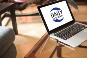 Photo of a laptop displaying the DAISY logo