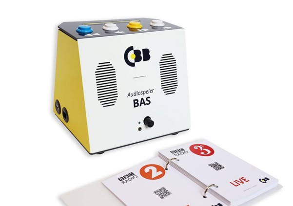 photo of the BAS streaming audio player with a booklet of QR codes used to select source.