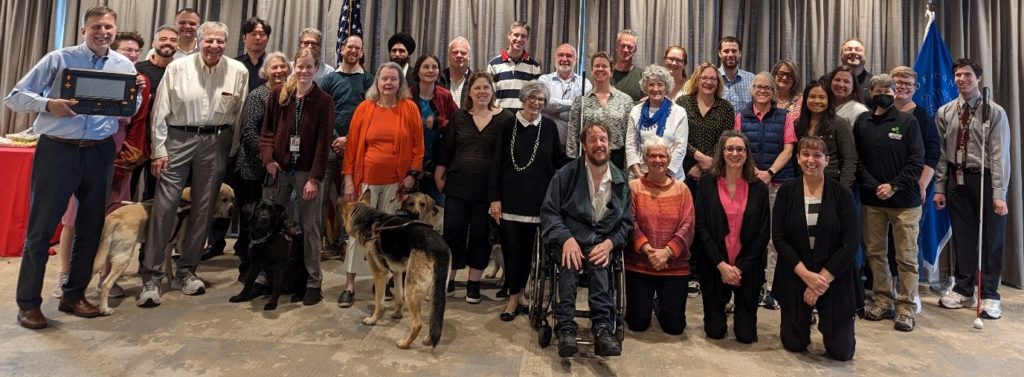 photo showing a diverse group of 36 people and 4 guide dogs taken at the Washington DC meeting