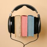 photo of three books placed within headphones representing accessible books