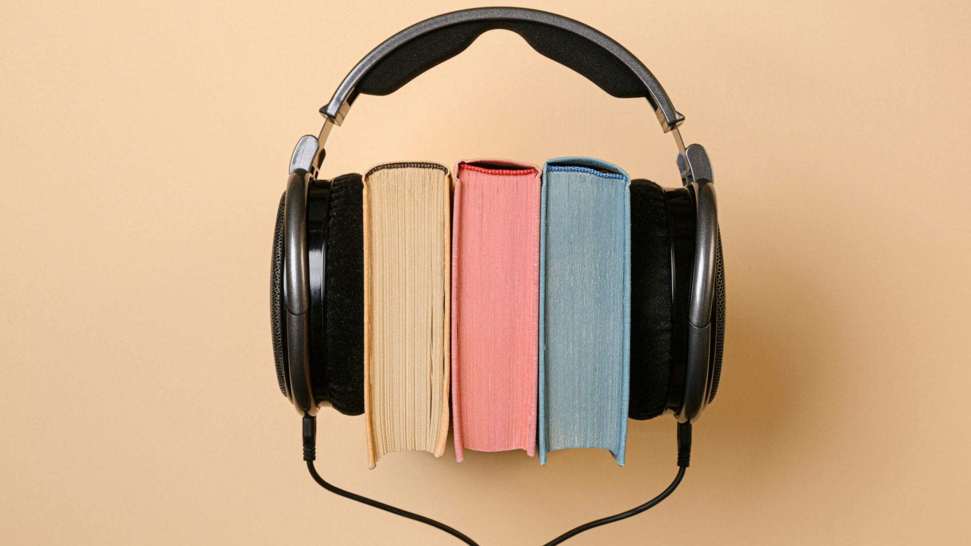 photo of three books placed within headphones representing accessible books