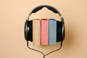 photo of three books placed within headphones representing accessible books