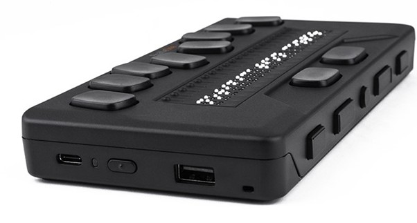 BrailleOne device photo shoing the input keys and Braille display